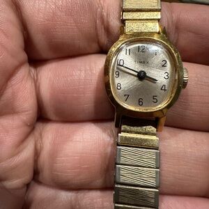 *WORKING* Timex women's gold tone watch. Small iridescent face. Stretch bracelet